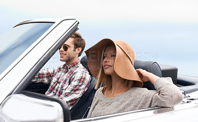 Buy stock photo Couple, convertible and driving on road or adventure in California or outdoor journey, sun hat or vacation. Man, woman and environment on mountain or relaxing trip with transport, weekend or happy
