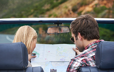 Buy stock photo Map, driving and back of couple in a car for travel to vacation, adventure or holiday destination. Reading, atlas guide and young man and woman on journey in vehicle for weekend road trip together.