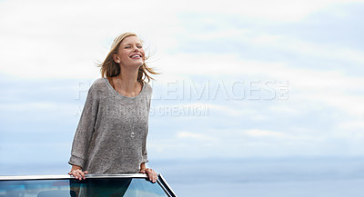 Buy stock photo Smile, blue sky and convertible car with woman on road trip for travel, vacation or holiday in summer. Mockup, driving and journey with happy young person in vehicle for transport in fresh air