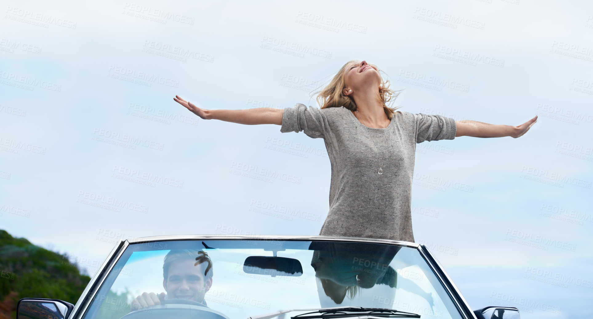 Buy stock photo Man, driving and convertible or woman freedom with arms up on road trip for travel adventure, journey or explore. Couple, happy and together in California for weekend holiday or date, vacation or joy
