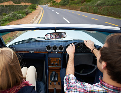 Buy stock photo Couple, driving and convertible steering wheel on road from behind on mountain for vacation, adventure or holiday. Man, woman and transportation in California for travel destination, relax or nature