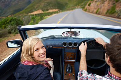 Buy stock photo Couple, driving and convertible steering wheel on mountain from behind for vacation happy, adventure or holiday. Man, woman and portrait on transportation in California for travel, relax or nature