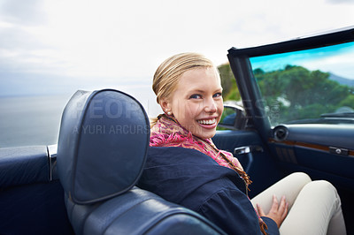 Buy stock photo Shot of a young woman on a roadtrip