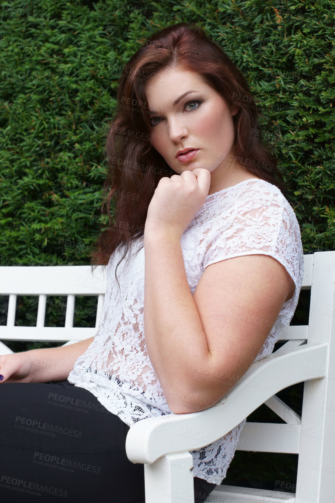 Buy stock photo Beauty, fashion and portrait of a woman on a chair in nature with plants, makeup and cosmetics. Serious plus size female person or stylish model with a green bush, natural confidence and strong pose