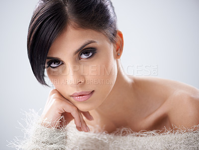 Buy stock photo A beautiful young woman in a furry jersey smiling at the camera