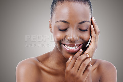 Buy stock photo Cosmetics, beauty and face of black woman on mockup with smile, natural makeup or facial in studio. Skincare, dermatology and happy girl on grey background space for skin glow, shine and wellness.