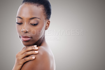 Buy stock photo Skincare, mockup and face of black woman in studio with shoulder, natural makeup and healthy glow. Cosmetics, dermatology and beauty model on grey background space for skin care, shine or wellness.