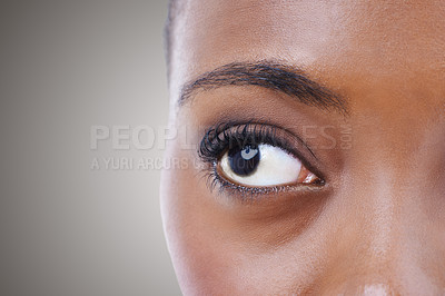 Buy stock photo Half, face and eye of woman with vision for contact lenses and healthcare in studio background mockup. Optometry, eyesight and African model seeing, visual or search perception in optical exam