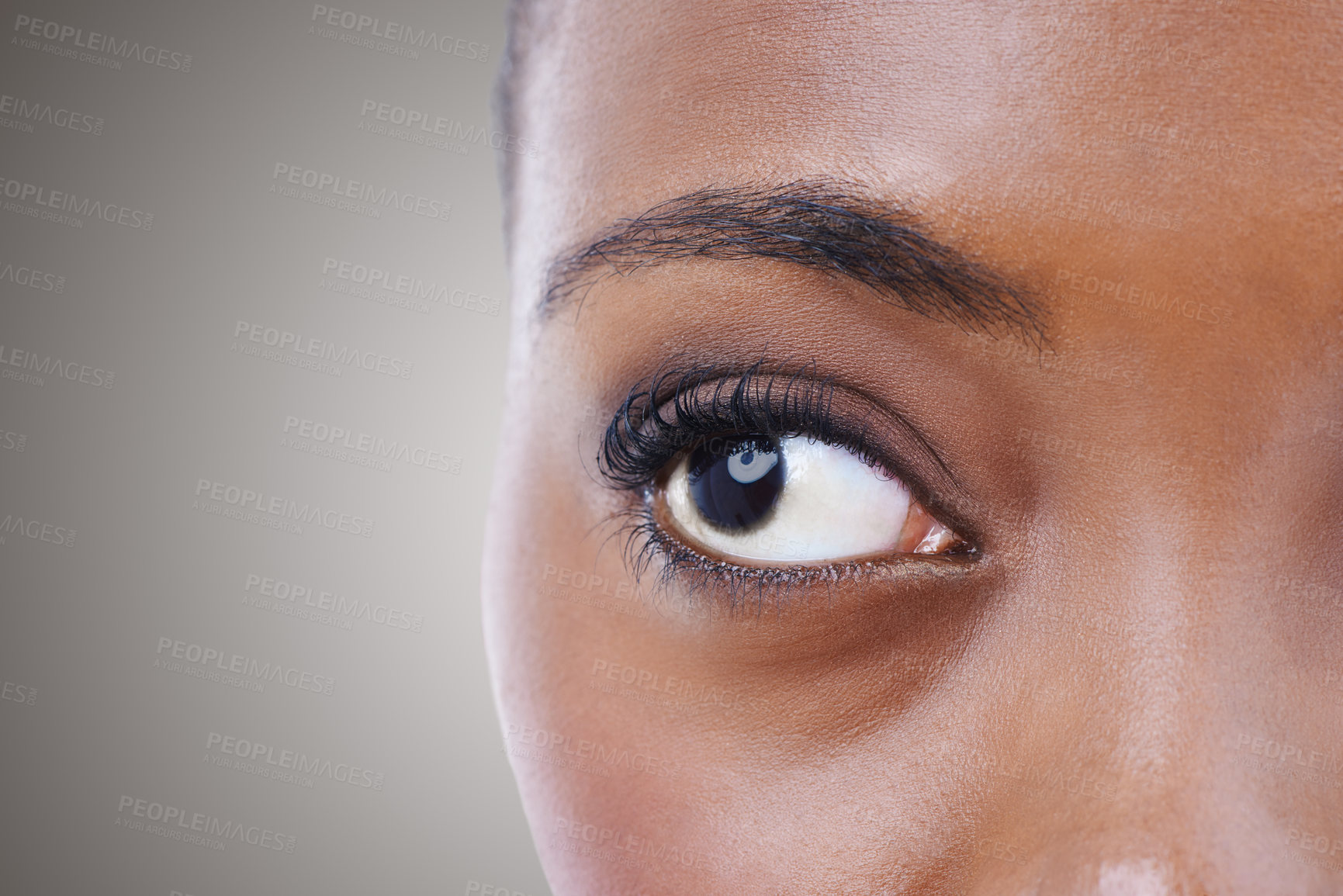 Buy stock photo Half, face and eye of woman with vision for contact lenses and healthcare in studio background mockup. Optometry, eyesight and African model seeing, visual or search perception in optical exam