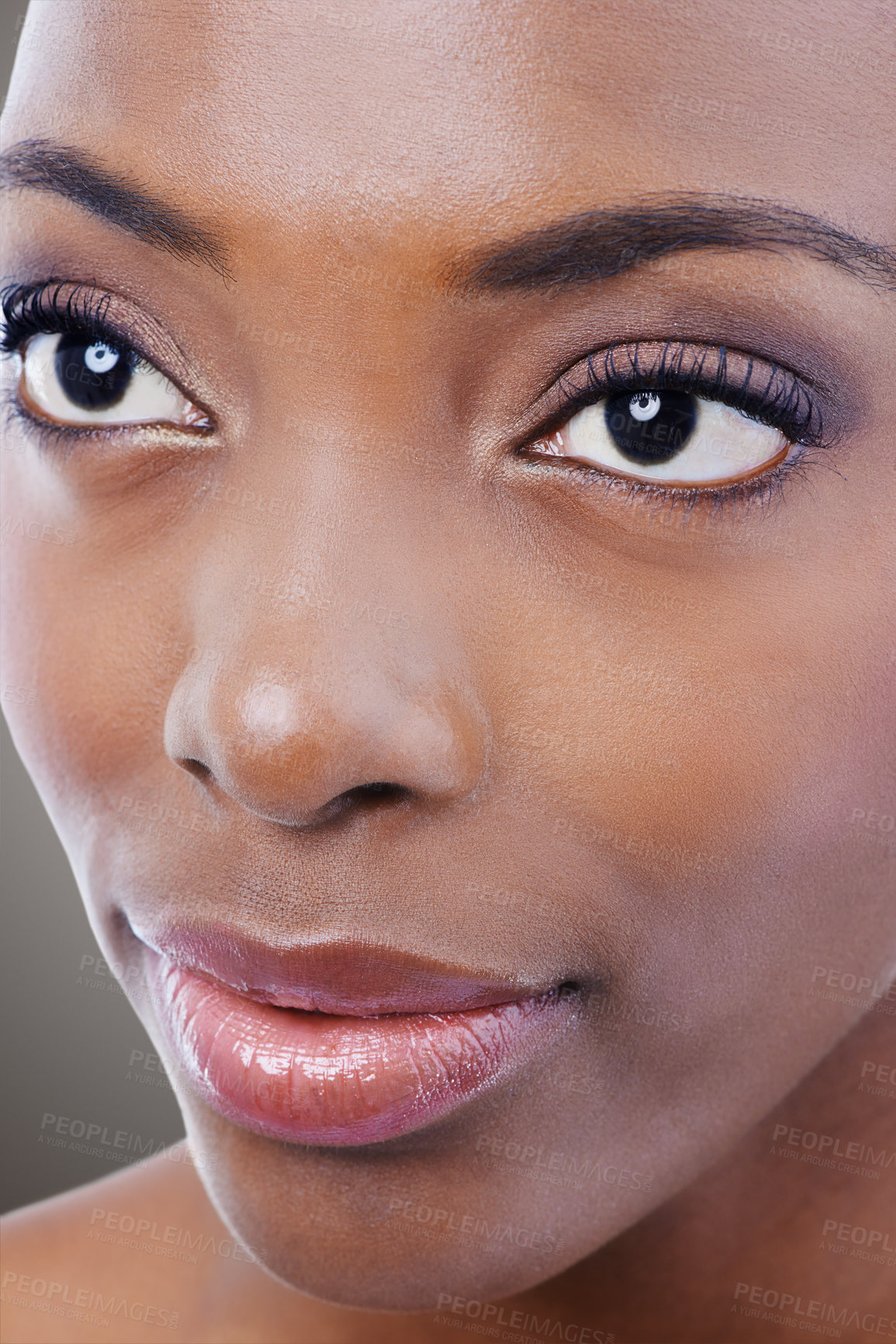 Buy stock photo Makeup, beauty and face of black woman on gray background for wellness, cosmetics and skincare. Dermatology, salon aesthetic and closeup of person with eyeshadow, lipstick and glamour in studio