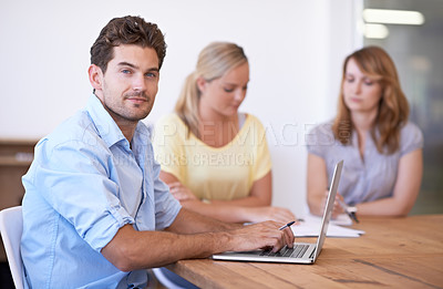 Buy stock photo Meeting, teamwork and portrait of man with laptop for business, planning and research in office. People, talking and working with collaboration on document, review and businessman typing a report