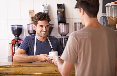 Buy stock photo Man, barista and cup in coffee shop, serving customer and working in restaurant or small business. Male person, entrepreneur and caffeine expertise in bistro, confidence and friendly in hospitality