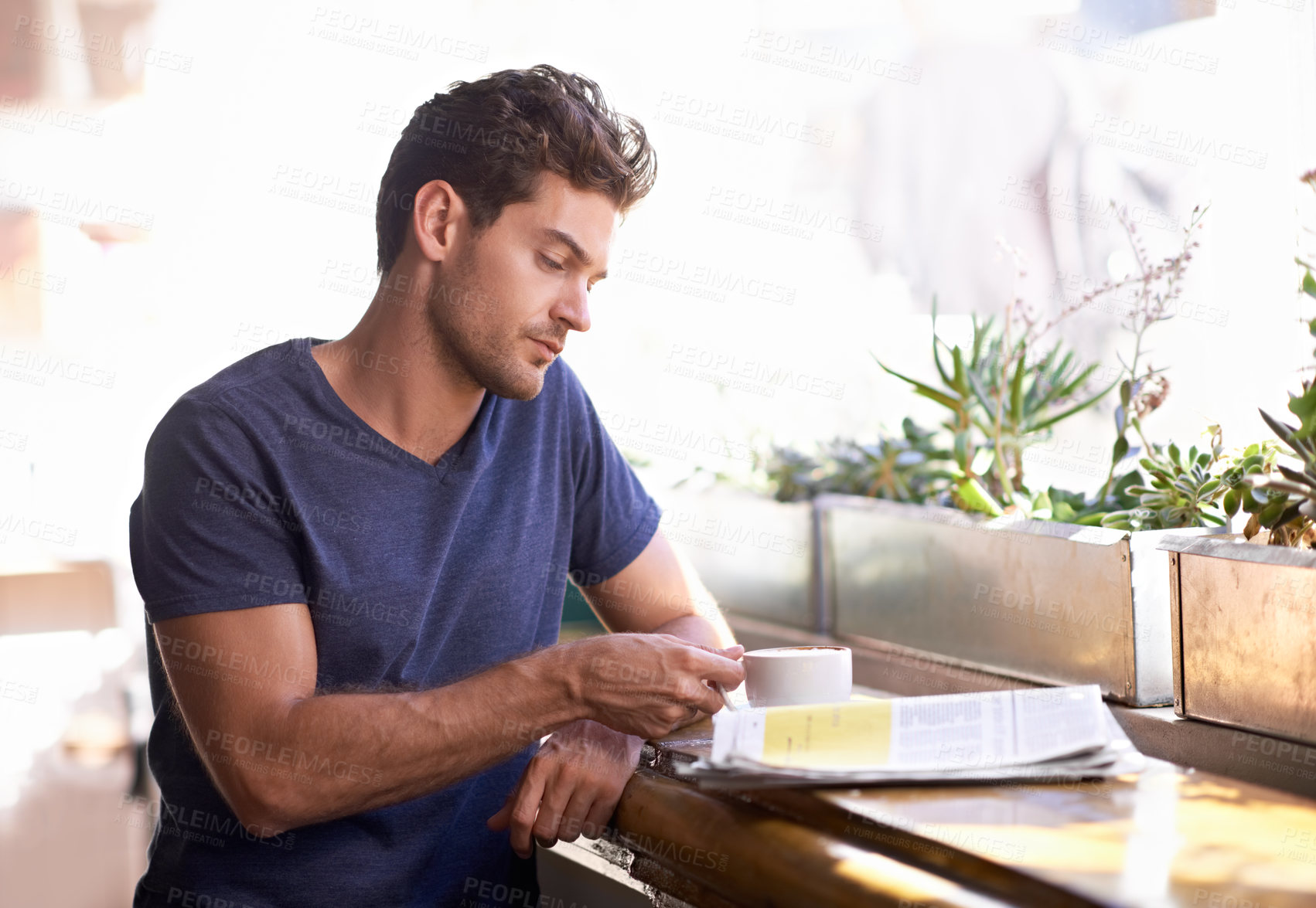 Buy stock photo Man, coffee shop and relaxing with newspaper and cup, hot beverage and article for information. Male person, restaurant and reading paper for announcement, print and story for update and tea at cafe