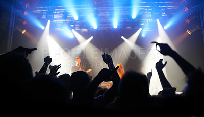 Buy stock photo Concert, dance and audience at a band performance, techno festival and event with people on a stage in the dark. Night club, dancing and crowd with freedom, energy and rock at a music festival