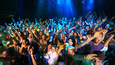 Buy stock photo Shot of a large crowd at a music concert