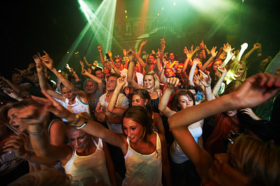 Buy stock photo Party, music and dance with crowd at concert for rock, festival and live band performance. Light, laser and energy with audience listening to dj at club for disco, celebration and rave night event