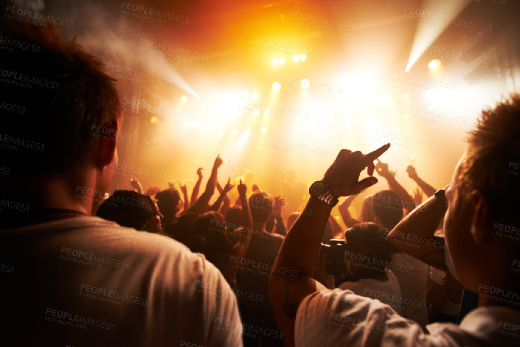 Buy stock photo Rear view of a crowd cheering at a concert - This concept was created for the sole purpose of this photo shoot, featuring 300 models and 3 live bands. All people in this shoot are model released