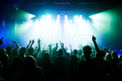 Buy stock photo Music, dance and party with crowd at concert for rock, live band performance and festival show. New year, celebration and disco with audience of fans listening to techno, rave and nightclub event