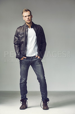 Buy stock photo Fashion, style and portrait of a man in studio with casual, trendy and stylish clothes. Serious and handsome male model person on a grey background with hands in jeans pocket for confidence pose