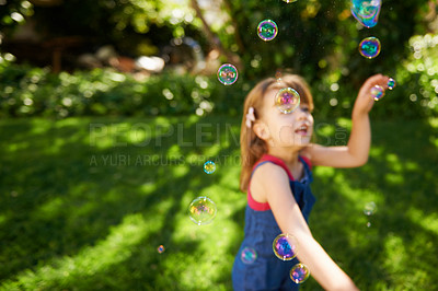 Buy stock photo Child, bubbles and garden grass for playing in summer sunshine in backyard for holiday, carefree or happy. Kid, girl and youth in California in outdoor nature or fun for vacation, weekend or game