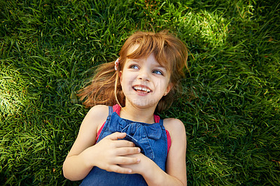 Buy stock photo Child, grass and smile in backyard or above for relax holiday in countryside for summer vacation, nature or park. School kids, happy and California garden or environment for laugh, sunshine or meadow