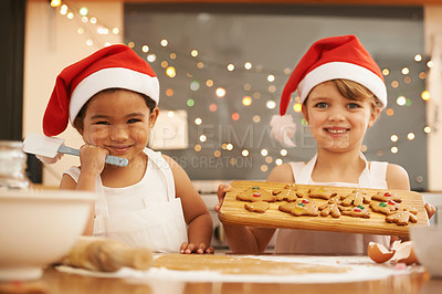 Buy stock photo Children, baking or bonding with christmas hats in house or family home kitchen with sweet cookies, ginger biscuits or snacks. Portrait, smile or festive cooking kids, friends or adopted girls treats