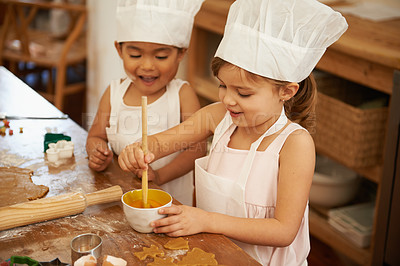 Buy stock photo Children, girls and bonding in baking activity in house or home kitchen for breakfast food, dessert pastry or cookies. Happy kids or friends learning and cooking with eggs, chefs hat or biscuit dough