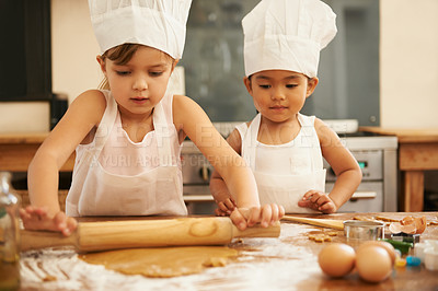 Buy stock photo Baking, helping and children in the kitchen with dough for cookies together in a house. Cooking, baker and young girl friends making baked food, breakfast or a snack with help in a bakery or home