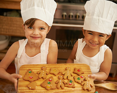 Buy stock photo Portrait, girls and Christmas cookies in kitchen, smile and happy for festive, holiday and joy. Xmas, female friends and baking treats together, for celebration and happiness on vacation and break.