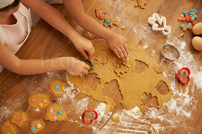 Buy stock photo Top view, children hands and baking with cookie cutters in house or family home kitchen with pastry, eggs or sweets. Kids, girls or bonding siblings cooking breakfast biscuits, dessert and wheat food