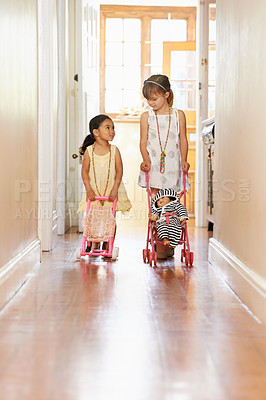 Buy stock photo Full-length shot of two little girls pushing prams