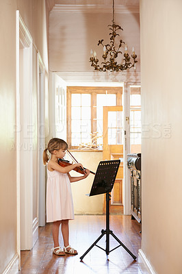 Buy stock photo Violin, girl and child playing in home, learning and practice for education, music or performance. Art, fiddle and kid with bow for talent, creative or hobby in house with acoustic string instrument