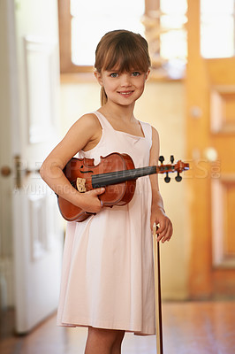 Buy stock photo Violin, girl and portrait of happy kid in home for learning, practice and music education. Art, fiddle and student with bow for talent, creative or hobby with acoustic string instrument in Canada