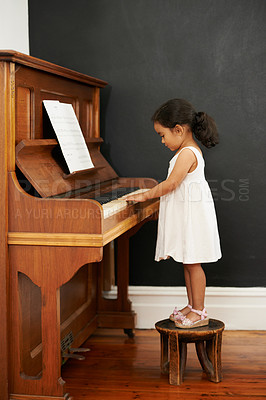 Buy stock photo Piano, stool and kid in home for learning, practice and classical education with musical notes. Training, melody and student with talent, creative or hobby with instrument, child development or skill