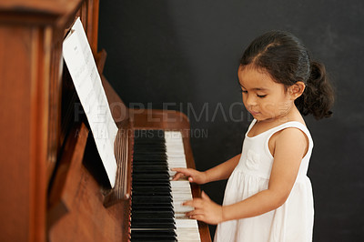 Buy stock photo Piano, girl and kid in home for learning, practice and classical education with musical notes. Training, melody and student with talent, creative or hobby with instrument, child development or skill