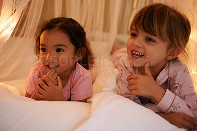 Buy stock photo Happy, lights and children at night in bedroom for resting, relaxing and dreaming in home. Sleepover, sibling and young girls with fairy light decoration on bed for fantasy, magic and childhood