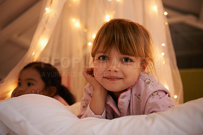 Buy stock photo Bedroom, lights and portrait of children at night for resting, relaxing and dreaming in home. Happy, smile and face of young girls with fairy light decoration on bed for fantasy, magic and childhood