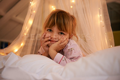 Buy stock photo Bedroom, lights and portrait of child at night for resting, relaxing and dreaming in home. Happy, smile and face of young girl with fairy light decoration on bed for fantasy, magic and childhood