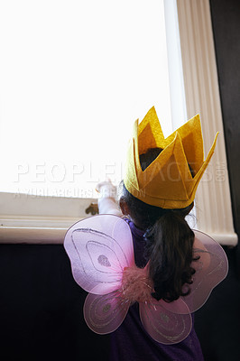 Buy stock photo Rearview shot of a little girl dressed up in her 