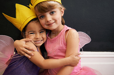 Buy stock photo Portrait of two little girls embracing while dressed up as fairies