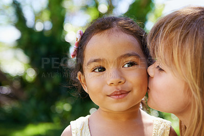 Buy stock photo Closeup, little children and cheek kiss in nature for fun, playing and bonding outside. Affection, outdoors and friendship with girl kids face for vacation or holiday in Sydney, Australia in summer
