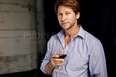 Buy stock photo Portrait, wine tasting and a man in the cellar of a vineyard on a farm for the production or fermentation of alcohol. Glass, distillery and a male farmer drinking a beverage for quality control