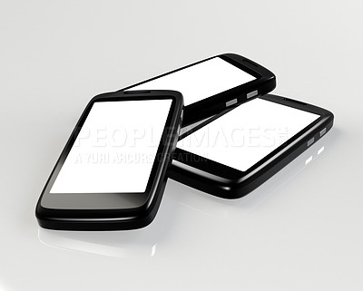 Buy stock photo Shot of three smartphones with blank screens for copyspace