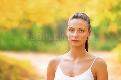 Buy stock photo Portrait of a fit young woman standing in a park in autumn