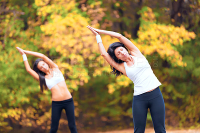 Buy stock photo Women, exercise stretching and calm in a outdoor park for yoga and fitness. Health, wellness and arm stretch of female friends in nature on forest feeling relax from body and sport together in woods