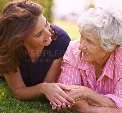 Buy stock photo Senior, mother and woman holding hands outdoor to relax in garden in summer, holiday or vacation together. Elderly, mom and family with love, care and support and smile in retirement with wellness