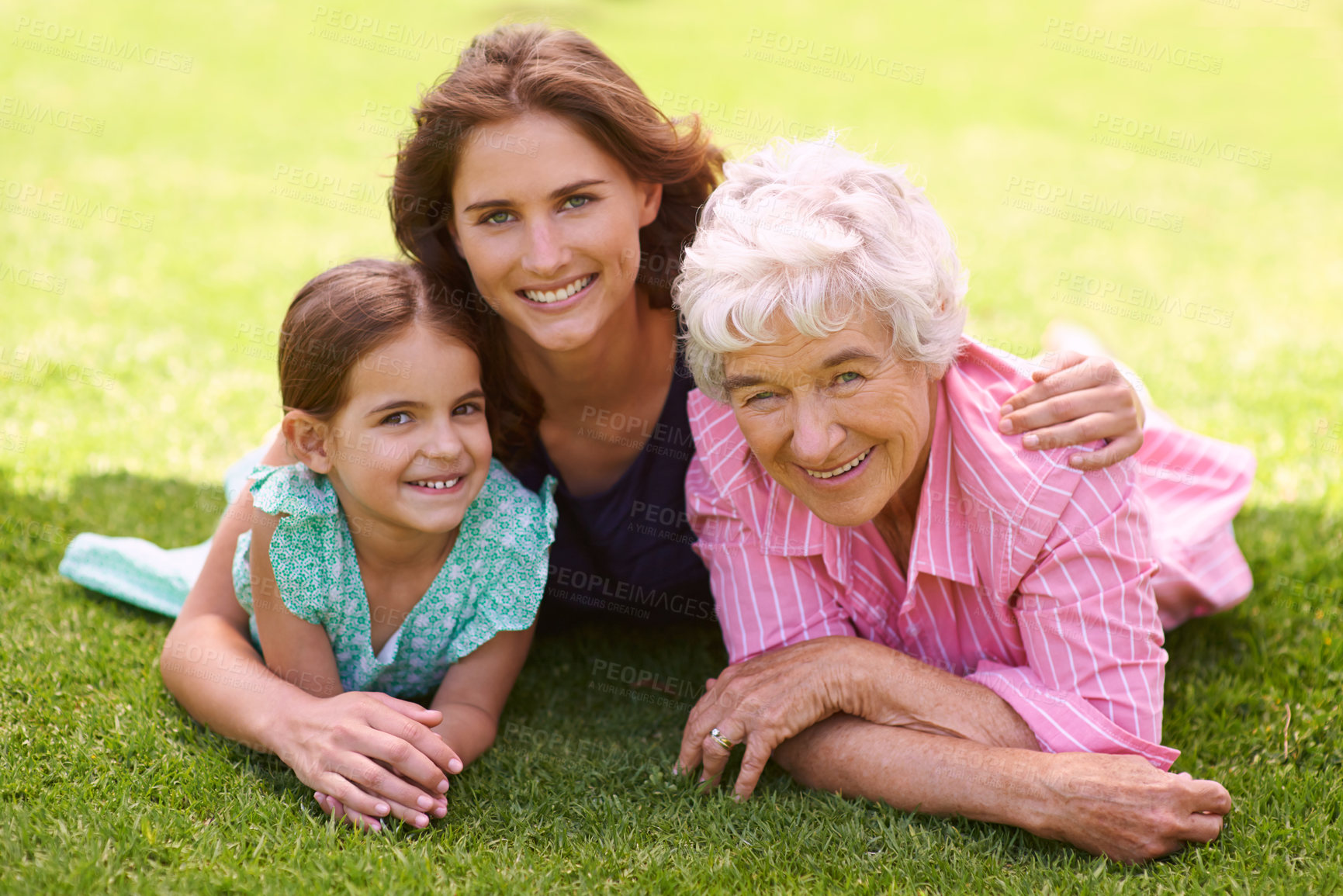 Buy stock photo Child, mom and grandmother hug in portrait outdoor to relax in summer, holiday or vacation together. Happy, family and elderly mother smile on grass in garden with love and support in retirement