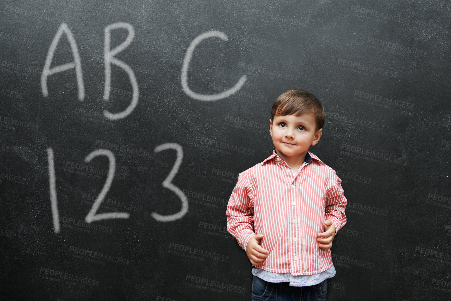 Buy stock photo Child, boy and face with smile by blackboard with letters, numbers and happiness in classroom at school. Kid, student and happy for knowledge, learning and chalkboard with math, alphabet or preschool