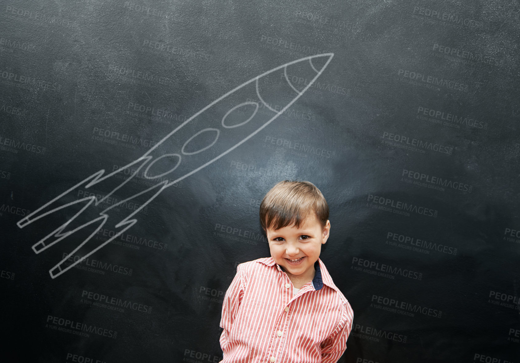 Buy stock photo Child, boy and portrait or happy by blackboard with drawing, missile and creative fun in classroom at school. Kid, student and smile for illustration, education or chalkboard with mockup at preschool