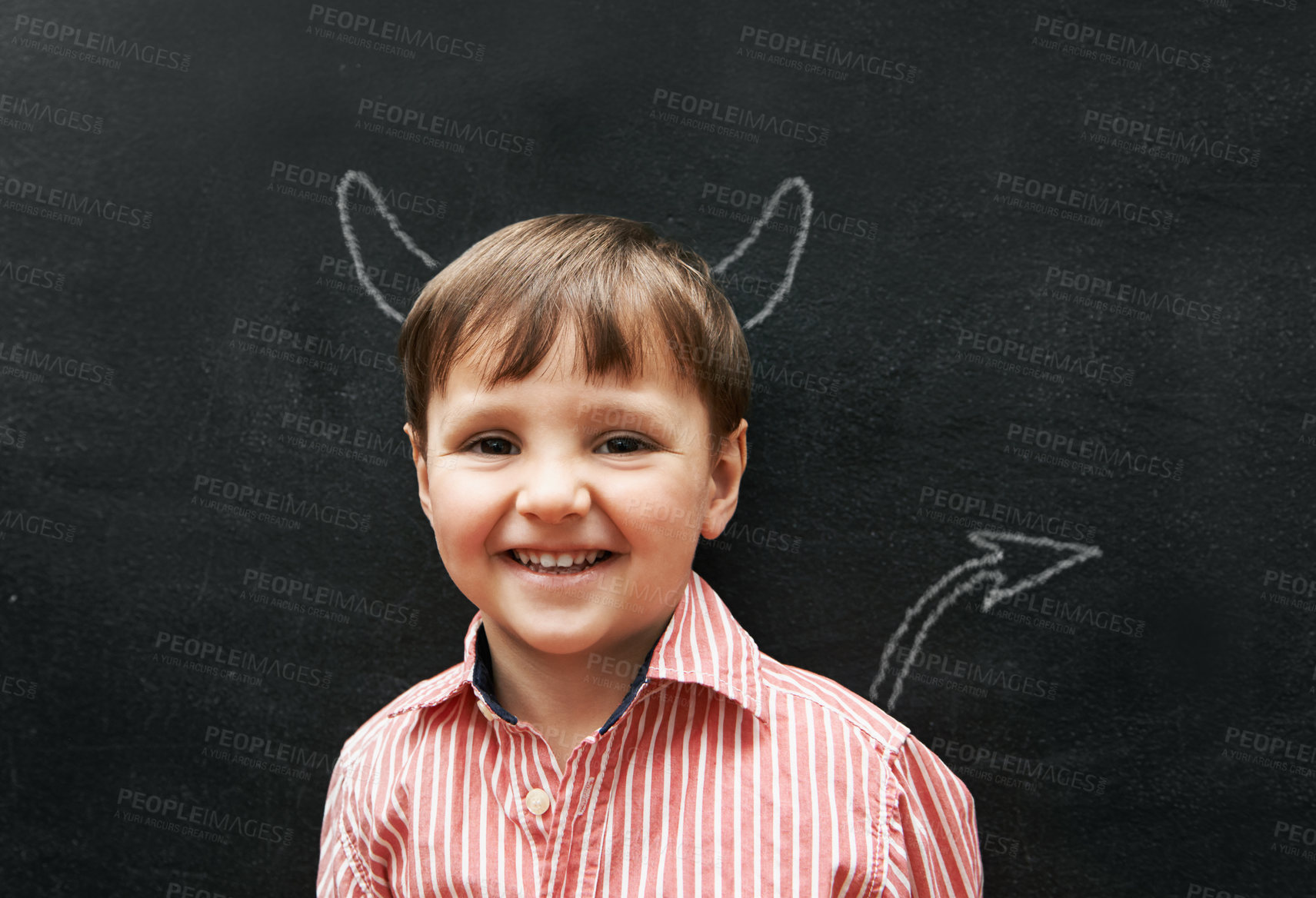 Buy stock photo Child, portrait and chalk with devil on board with smile in class, school and drawing for young skill development. Naughty, blackboard and creativity for mischief, education and growth with happiness